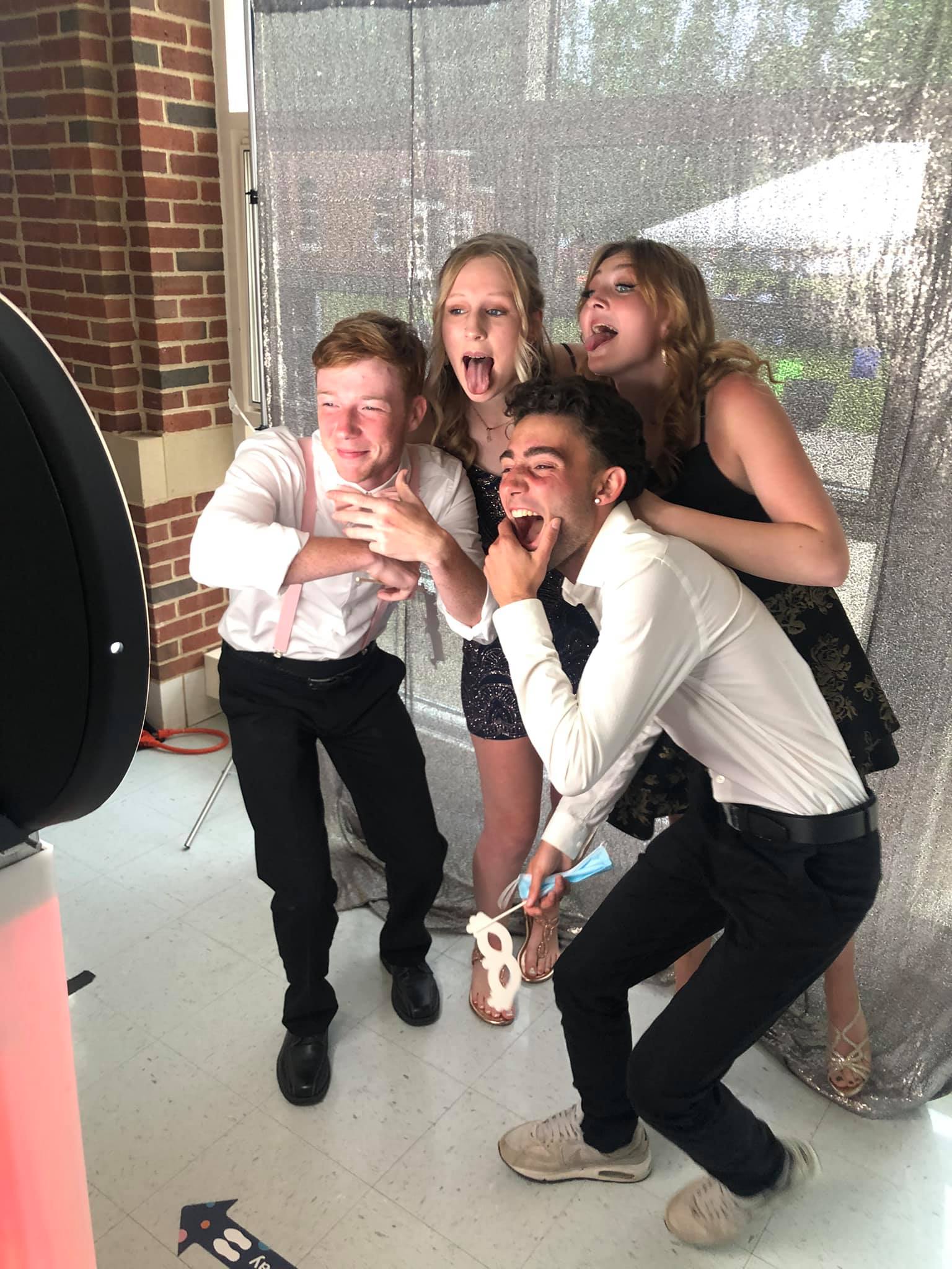 Friends posing together in a photo booth