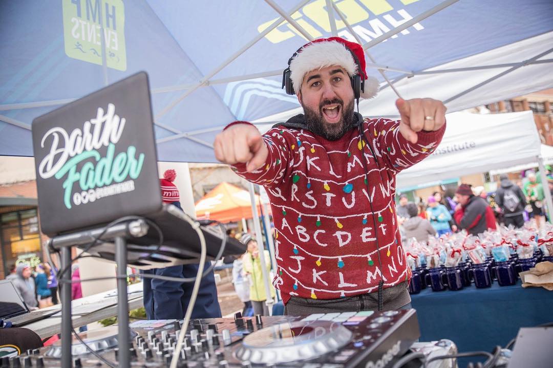 DJ performing at a festive outdoor event