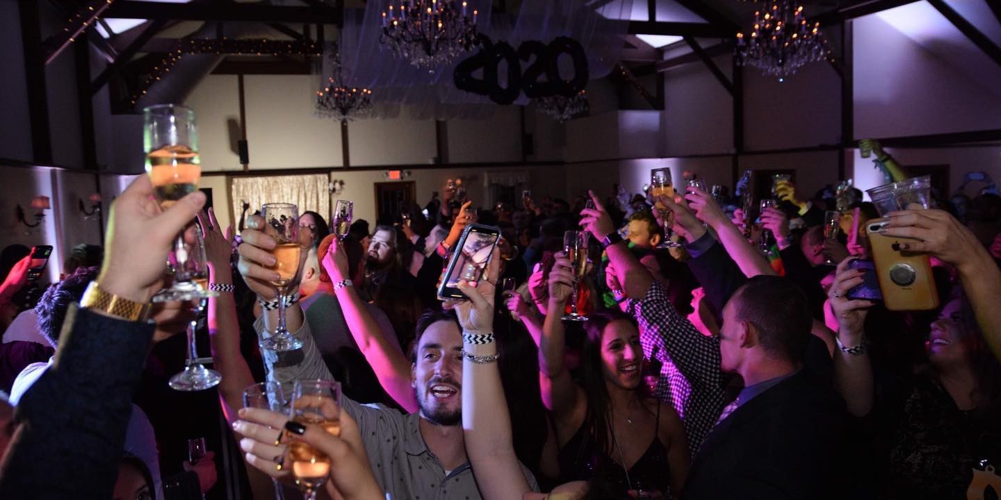Guests raising glasses at a private party